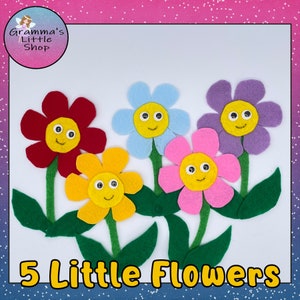 May include: Five felt flower shapes with happy faces. The flowers are red, yellow, blue, pink, and purple. The flowers are arranged in a row with green stems and leaves. The text "5 Little Flowers" is at the bottom of the image.