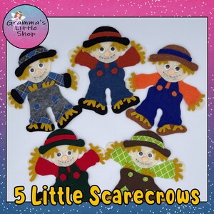 May include: Five felt scarecrows with different colored clothing and hats. The scarecrows are all smiling and have straw hair. The text "5 Little Scarecrows" is at the bottom of the image.