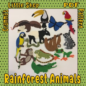 May include: A collection of felt rainforest animal cutouts, including a toucan, parrot, butterfly, anteater, tapir, snake, sloth, monkey, iguana, frog, crocodile, and lemur. The words "Little Shop", "Gramma's", "PDF", "Pattern", and "Rainforest Animals" are also visible.