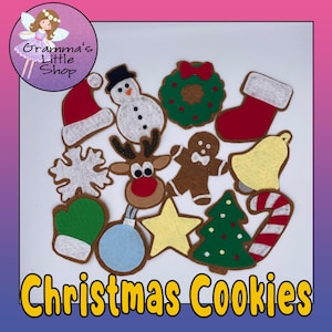 May include: A set of felt Christmas cookie ornaments, including a snowman, reindeer, gingerbread man, stocking, bell, candy cane, star, snowflake, mitten, Christmas tree, wreath, and ornament. The ornaments are brown, red, green, white, yellow, and blue.