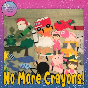 Può includere: Un set di gioco in feltro con vari personaggi e oggetti, tra cui un camion dei pompieri, un gatto, una rana, un albero, un mostro, una principessa, una scatola di pastelli e il testo "No More Crayons!"