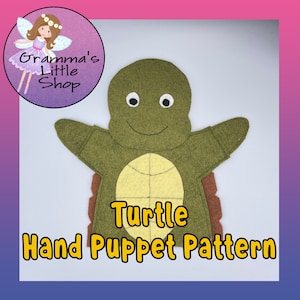 May include: A green felt turtle hand puppet pattern with a yellow shell and brown feet. The puppet has a smiling face with white eyes. The text "Turtle Hand Puppet Pattern" is written in yellow letters below the puppet.