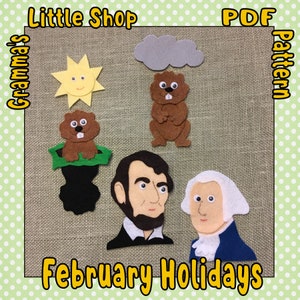 May include: A felt PDF pattern with a sun, cloud, beavers, and portraits of Abraham Lincoln and George Washington. The text "February Holidays" is displayed at the bottom. The words "Little Shop" and "Gramma's Pattern" are also visible.