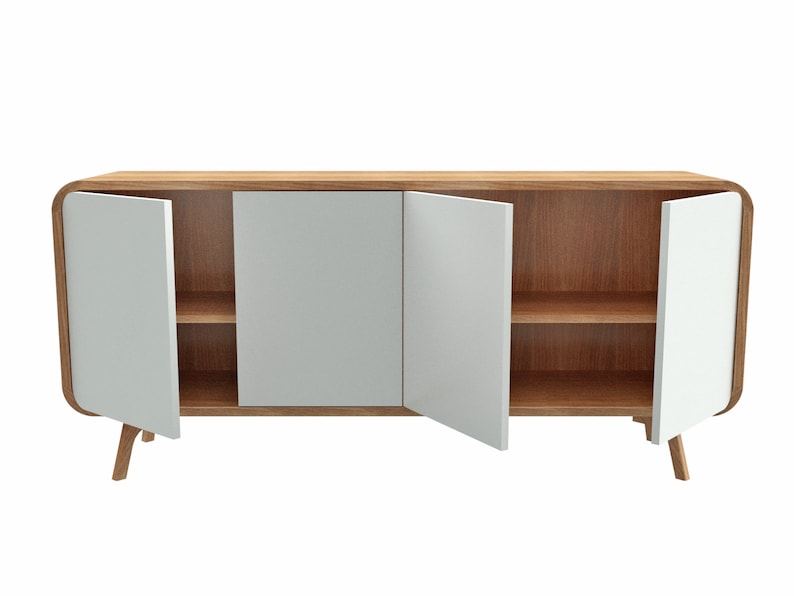 May include: A wooden cabinet with three white doors and two shelves. The cabinet has rounded edges and sits on four wooden legs.