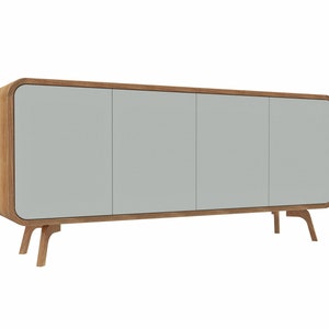 May include: A light gray cabinet with three doors and rounded edges. The cabinet has a wood frame and sits on four wooden legs.