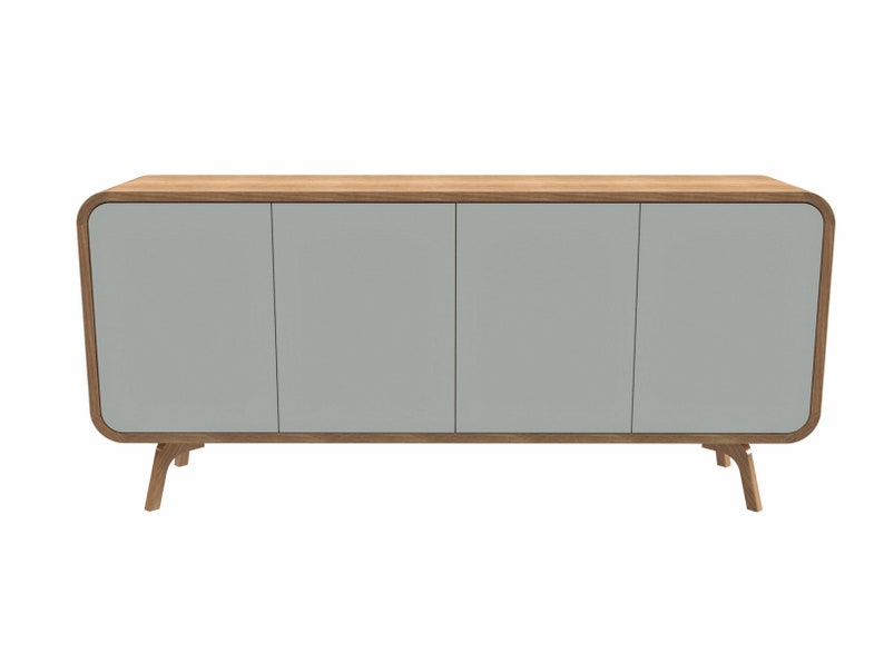May include: A light gray sideboard with three doors and rounded edges. The sideboard has a wood top and legs.
