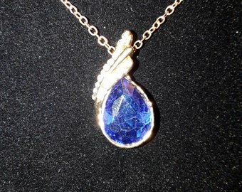 Dark Blue Swarovski Crystal in a gold tone setting