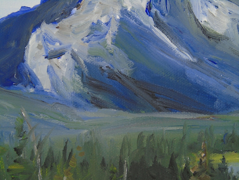 May include: A painting of a mountain range with a blue and white sky. The mountain range is in the background and the foreground is a forest of green trees.