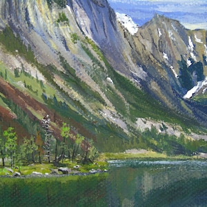 May include: An oil painting depicts a mountain landscape with a lake. The mountains are painted in shades of gray, green, and brown, with patches of snow. The lake reflects the mountains and sky, creating a serene scene.