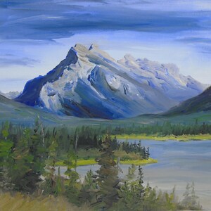 May include: A painting of a mountain range with a lake in the foreground. The mountain is a light blue color with a white peak. The lake is a light blue color with a green shoreline. The sky is a light blue color with white clouds.