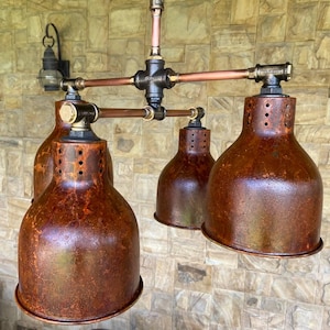 Ceiling Industrial Pendant Lighting in Copper with Rusty Lampshades.
