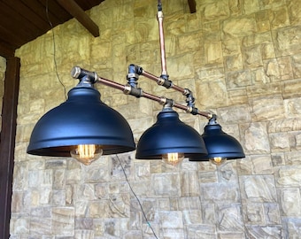 Copper kitchen ceiling chandelier with black industrial lampshade.