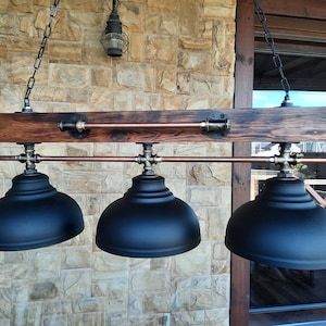 Wooden pendant chandelier with industrial style. Pendant lights for a farmhouse