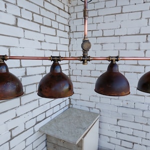 Rusty industrial ceiling chandelier. Rustic pendant lamp for a country house.Kitchen hanging lamp for dining table.