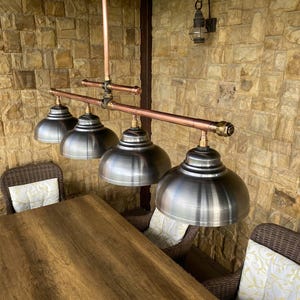 Large industrial pendant chandelier made of copper pipes with bronze fittings Rustic lighting for a kitchen island or a billiard table