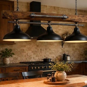 May include: A linear pendant light fixture featuring a thick, dark brown wooden beam suspended by chains. Three matte black metal dome shades are attached to the beam via dark metal pipes and fittings, creating a downward-facing lighting arrangement.