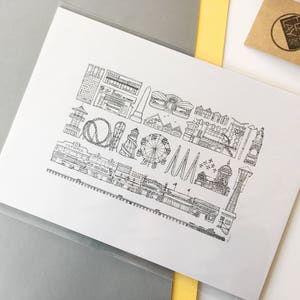 May include: Black and white line drawing illustration of a seaside amusement park with a Ferris wheel, roller coaster, and other attractions. The illustration is on a white background.