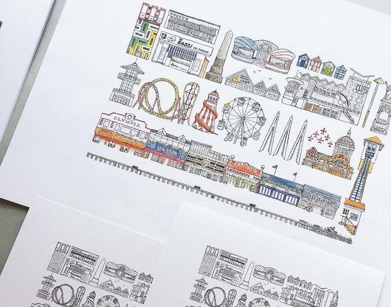 May include: A colorful illustration of a seaside amusement park with a Ferris wheel, roller coaster, and various buildings. The illustration is drawn in a cartoon style with black outlines and colored in with bright colors.