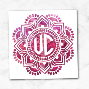 May include: A geometric mandala design in fuchsia holographic colors with a white monogram "WC" in the center.