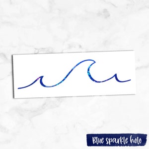 May include: A blue sparkle holographic wave sticker. The wave is a simple line drawing with a single crest.