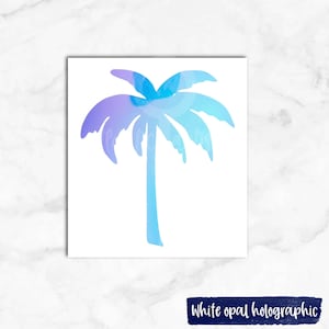 May include: A white opal holographic palm tree sticker. The palm tree is a light blue and purple gradient.