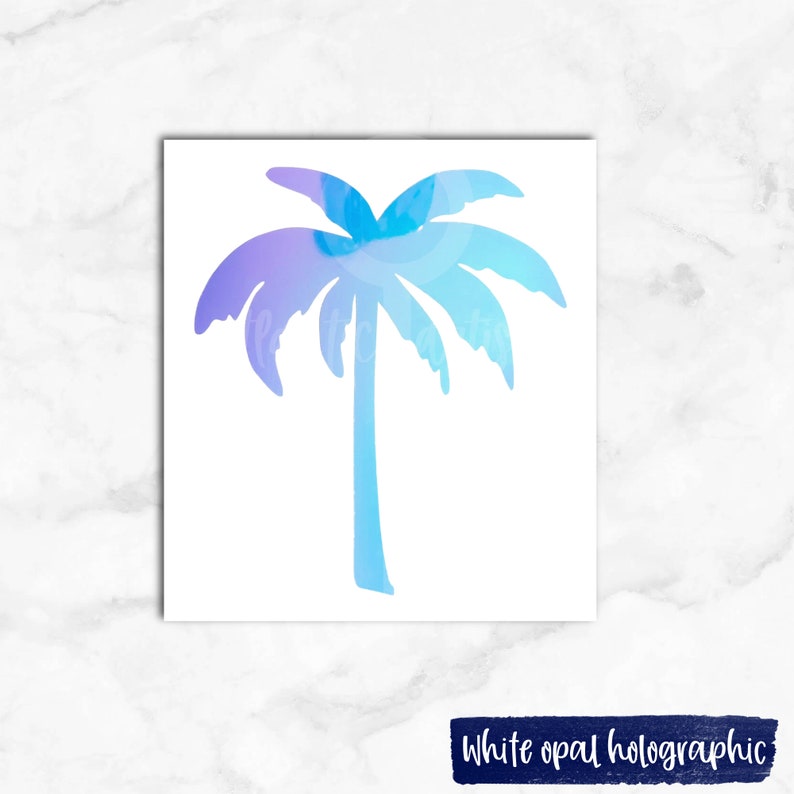 May include: A white opal holographic palm tree sticker. The palm tree is a light blue and purple gradient.