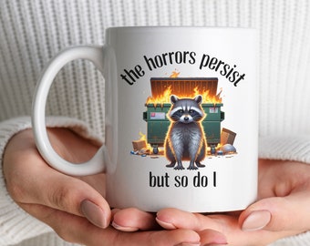 Funny Raccoon Gift for Best Friend or Coworker Mug, The Horrors Persist But So Do I Mug, Raccoon Trash Fire Coffee Cup, Dumpster Fire Vibes