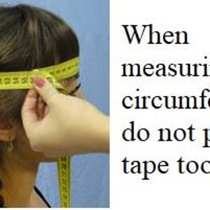 May include: A woman is measuring her head circumference with a yellow tape measure. The text on the image reads: "When measuring head circumference, do not pull the tape too tight."
