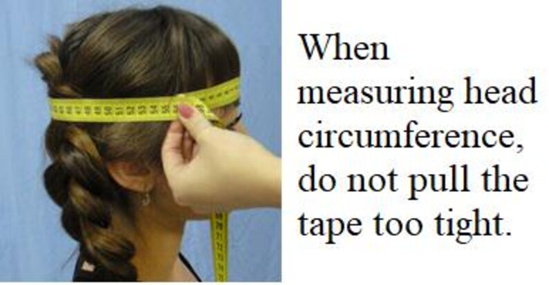 May include: A woman is measuring her head circumference with a yellow tape measure. The text on the image reads: "When measuring head circumference, do not pull the tape too tight."