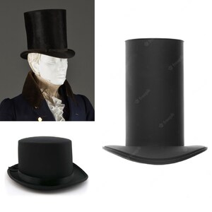 May include: Two black top hats. The top hat on the left is being worn by a mannequin. The top hat on the right is lying flat on a white surface.