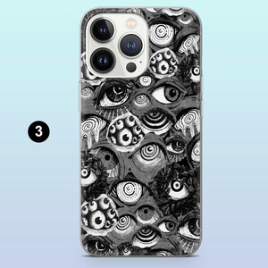 Op de afbeelding: Een telefoonhoesje met een herhaald patroon van gestileerde ogen in grijstinten en zwart. Het ontwerp bevat verschillende oogvormen en -maten, met ingewikkelde details en schaduwen. De hoes heeft een doorzichtige rand en een camera-uitsparing.