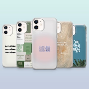 May include: Set of six phone cases with different designs and inspirational quotes. The cases are clear with white text and graphics. The quotes include "consistent", "make it happen", "healthy body healthy mind healthy soul", "abundance my reality", "good things ahead", and "you are energy".