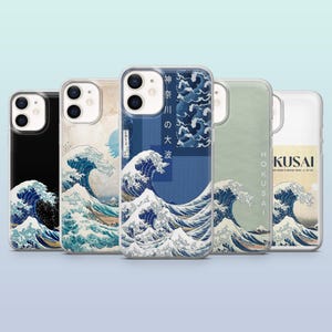 May include: A selection of phone cases showcasing the famous Japanese artwork "The Great Wave off Kanagawa." The cases feature the wave design in blue and white, with some including Japanese text and additional artistic details.