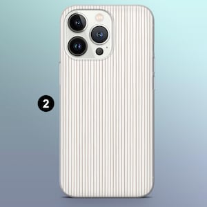 May include: A white phone case with a clear back and a striped pattern. The case has a raised camera bump with three lenses.
