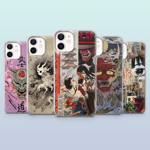 May include: Five phone cases with Japanese-inspired art. The cases feature images of demons, geishas, and traditional Japanese art. The cases are in clear plastic with a variety of colors, including red, purple, and beige.