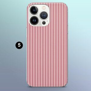 May include: A clear phone case with a red and white striped pattern. The case is designed for an iPhone with a camera bump.