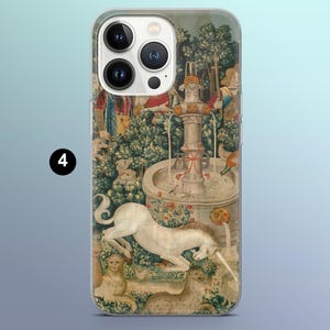 May include: A phone case featuring a detailed tapestry design with a unicorn, fountain, and figures. The artwork has a vintage aesthetic with muted colors and intricate details, creating a classic look.