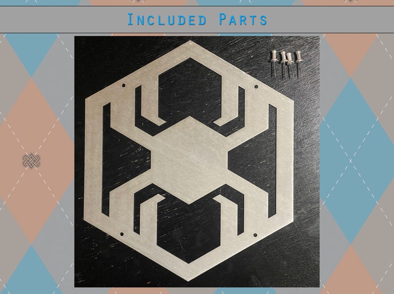 May include: A silver metal wall decor in the shape of a hexagon with a geometric design. The decor is on a black background and comes with five silver push pins.