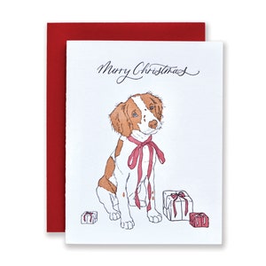 Tarjeta navideña con impresión tipográfica de un Spaniel Bretón