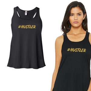 May include: Black tank top with a gold glitter design that says "#HUSTLER".