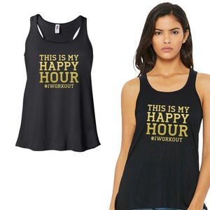 May include: Black tank top with gold lettering that reads "This is my happy hour #iworkout".