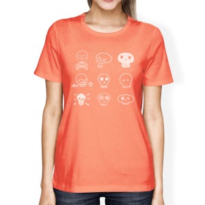 May include: A coral orange t-shirt with a white graphic of nine different skull designs. The skulls are all stylized and have different features, such as flowers, eyes, and crossbones.