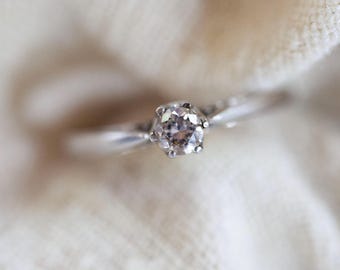 Vintage diamond solitaire engagement ring in 9k white gold