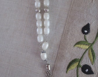 White beaded komboloi (worry beads)
