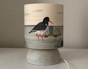 Handmade Pebble-Inspired Table Lamp with Oystercatcher Lampshade | Coastal Nature Lamp | Rustic Shelf Lighting