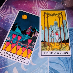 May include: Two tarot cards side by side. The left card, labeled EIGHT of CUPS, shows a person with a backpack walking away from eight red cups toward mountains under a yellow moon. The right card, labeled FOUR of WANDS, shows two people standing under a floral archway with a city skyline in the background.