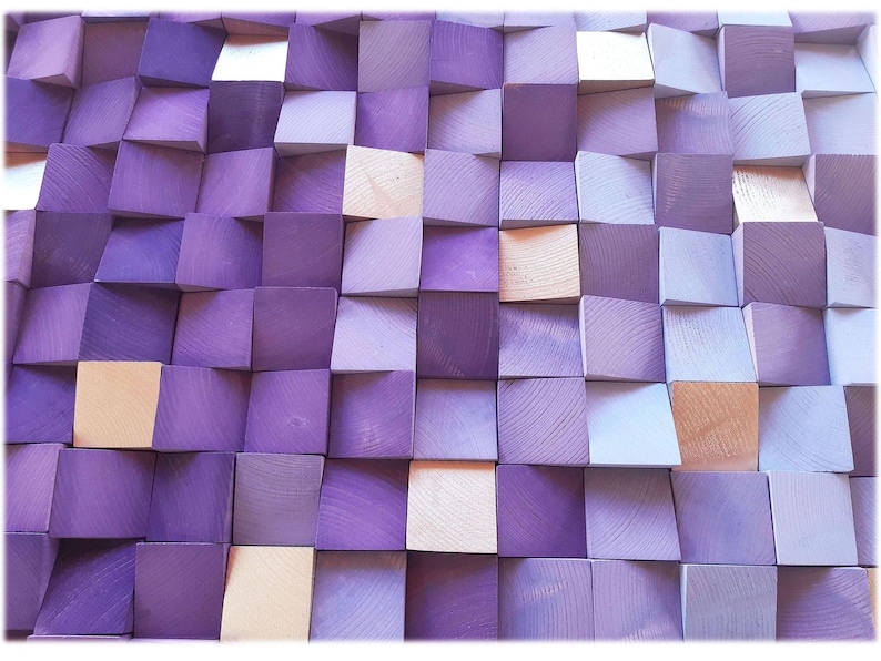 The image is a close-up of a textured surface composed of numerous small square wooden blocks in various shades of purple and light brown. The blocks are arranged in a grid-like pattern, creating a visually striking and intricate design.