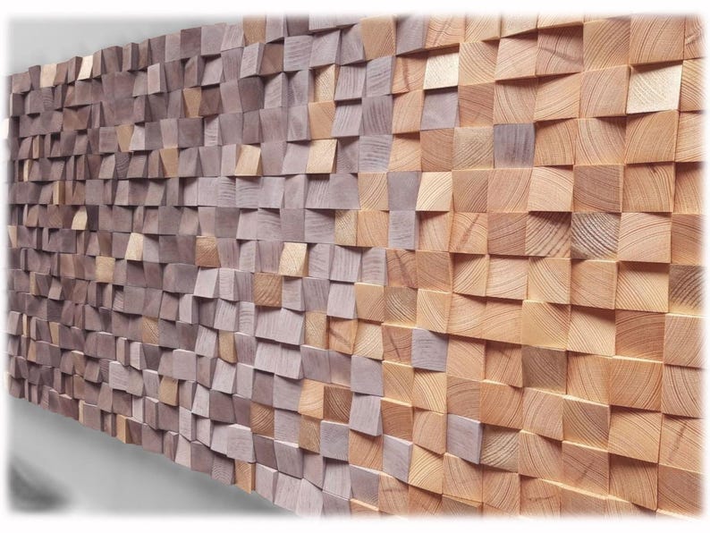 a wall made up of numerous wooden planks arranged in a textured, mosaic-like pattern. The planks vary in size and shape, creating a visually interesting and dynamic surface.