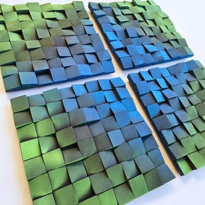 a collection of square-shaped, multicolored wooden blocks arranged in a grid-like pattern.