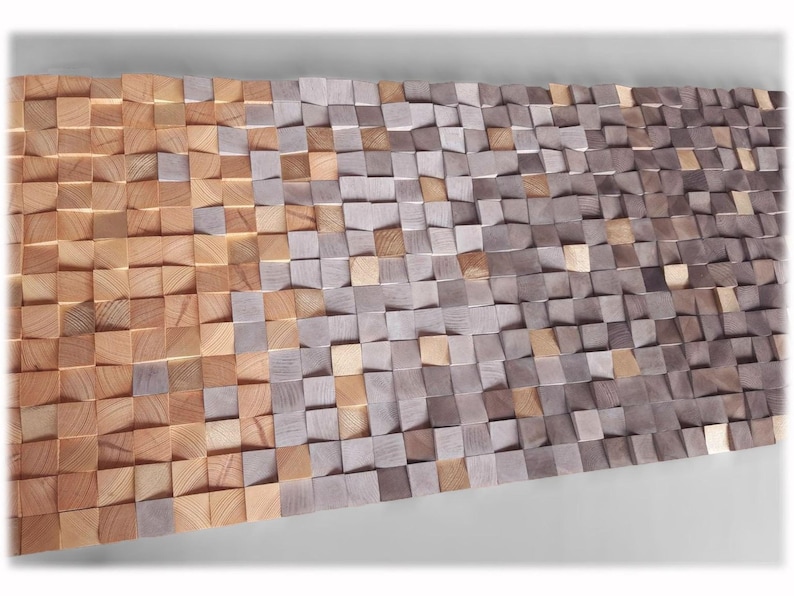 a large, textured surface composed of numerous small, square-shaped wooden blocks in various shades of brown and gray. The blocks are arranged in a pattern that creates a visually striking and intricate design.